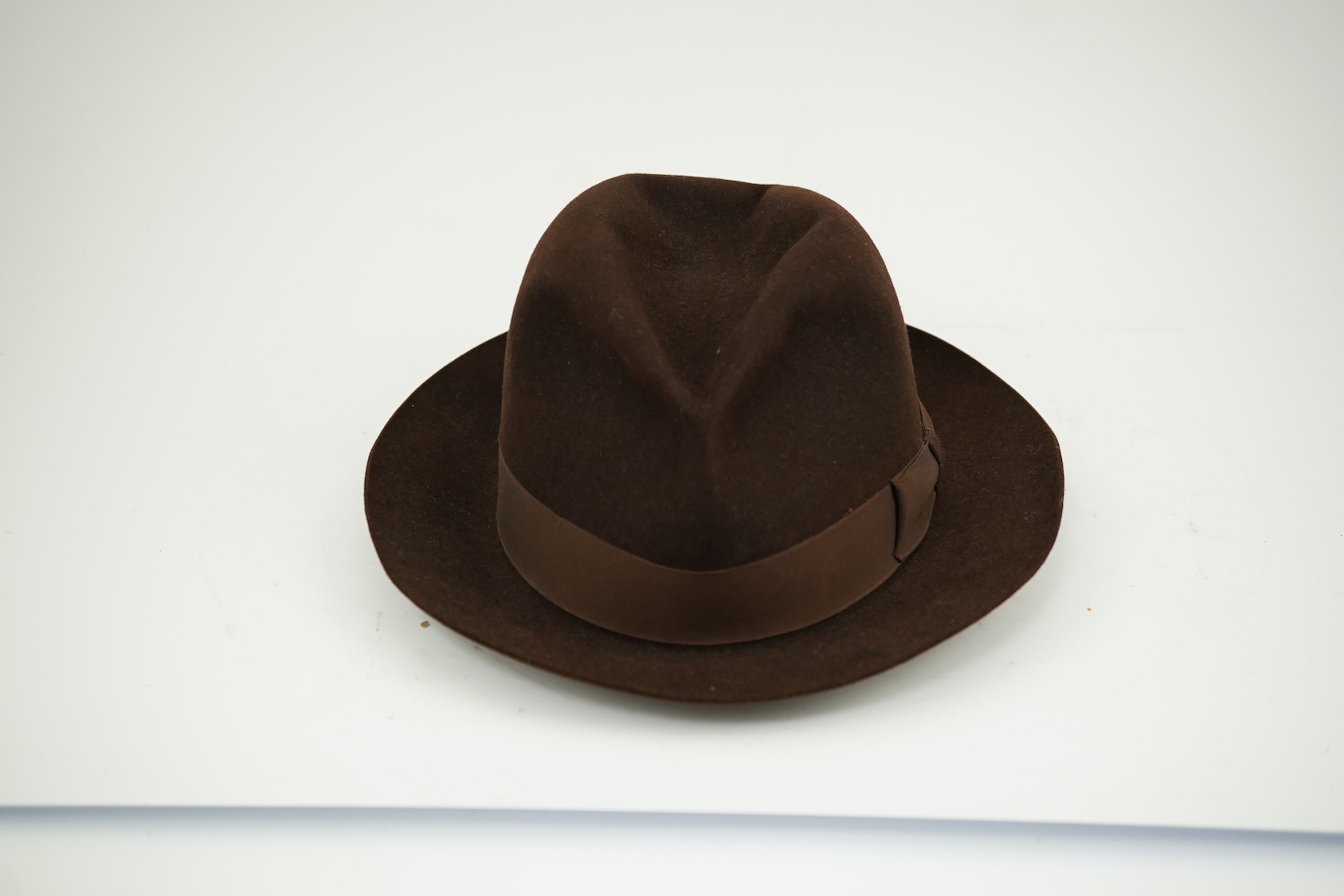 A brown felt Dunn and Co hat Size 56